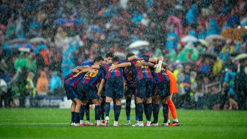Rain floods press area at Camp Nou